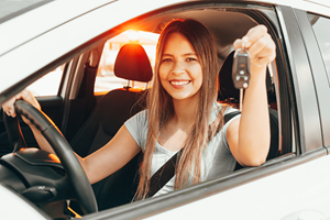 female driver holding car keys